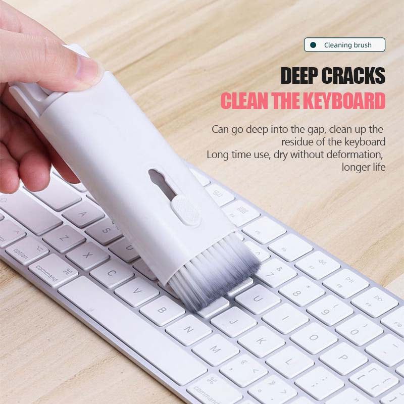 Cleaning brush cleaning a keyboard with text on deep cleaning capabilities