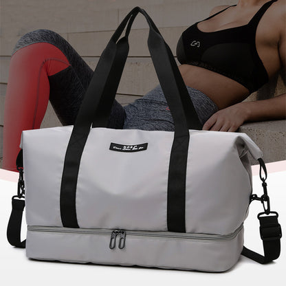 White weekender duffle  bag with black straps and a person in workout attire in the background. The bag has a bottom shoe compartment and a shoulder strap.