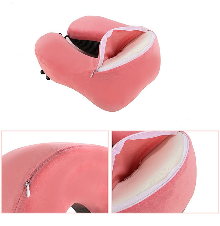 Pink travel neck pillow with zipper on a white background, showing the memory foam insert