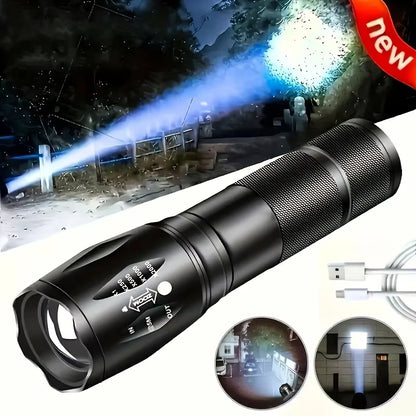 Black flashlight with zoomable lens and USB cable, shown in use at night.