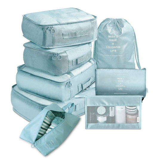 Set of light blue packing cubes and bags with text on a white background