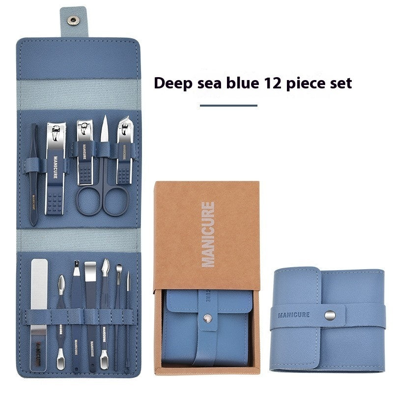Manicure nail set with tools in a deep sea blue case. The tools include tweezers, nail clipper, nail scissors, nail filer, ear cleaner, cuticle tool and more. There is an additional blue case closed. 