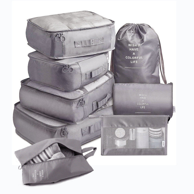 Set of gray packing cubes and bags with text on a white background