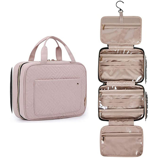 Pink travel bag with hanging toiletry organizer on a white background. There are 4 sections with multiple zipper sections and some elastic. 